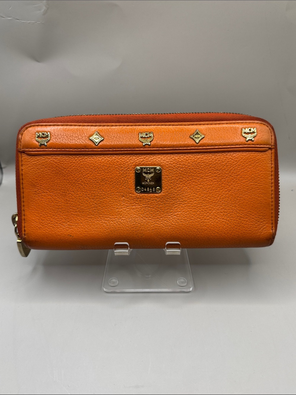 MCM Orange Leather Zip Wallet with Gold Logo Studs